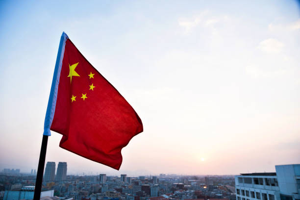 istock China flag waving in sunset 1094764114