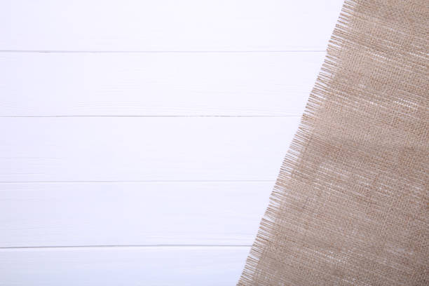 istock Natural sackcloth on a white wooden background. 1094764558