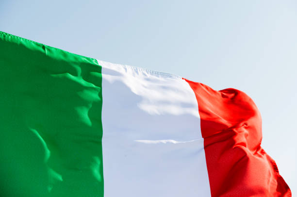 istock Italian flag waving in the sky 1094766262