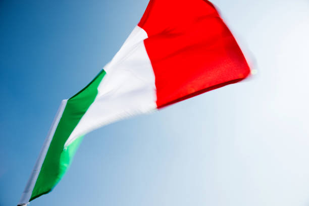 istock Italian flag waving in the sky 1094766268