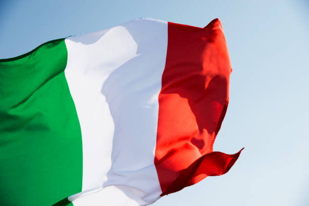 istock Italian flag waving in the sky 1094766286