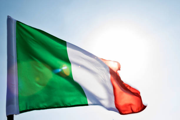 istock Italian flag waving in the sky 1094766332