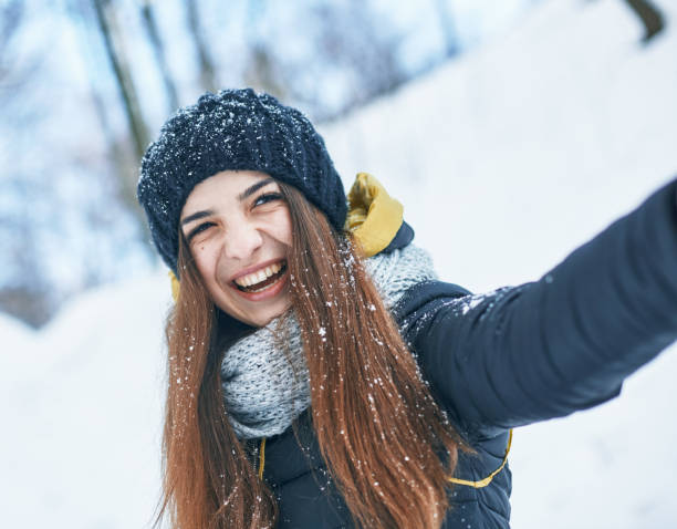 istock a Beautiful young woman in winter outside 1094768110
