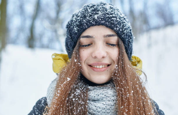 istock a Beautiful young woman in winter outside 1094768128