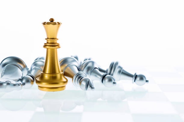 istock Golden queen standing on the chess board 1094770488