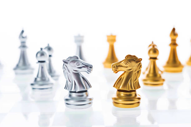 istock Golden and silver knights face to face 1094770694