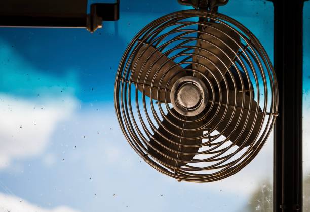 istock An old elecrtic fan in a school bus windshield. 1094773034