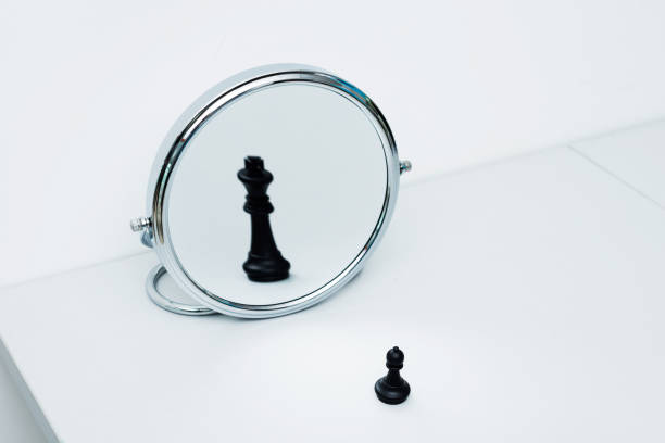 istock Black chess pawn imagining itself as a king 1094776224