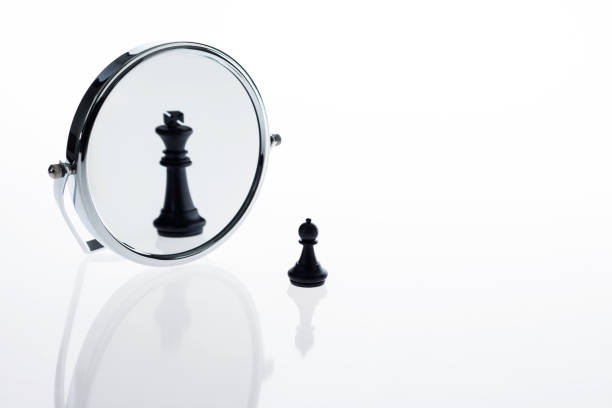 Black chess pawn imagining itself as a king.