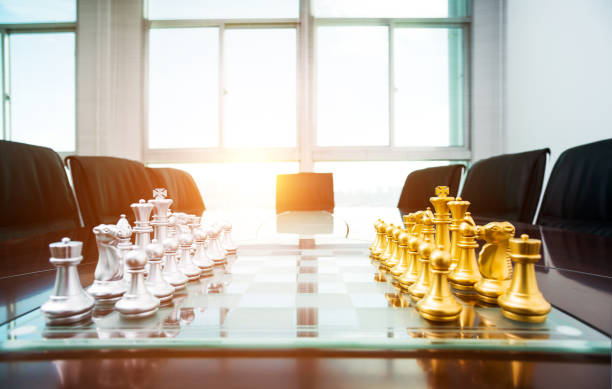 istock Chess pieces and board on the conference table 1094781154