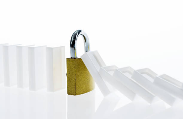 Domino pieces and lock on white background.