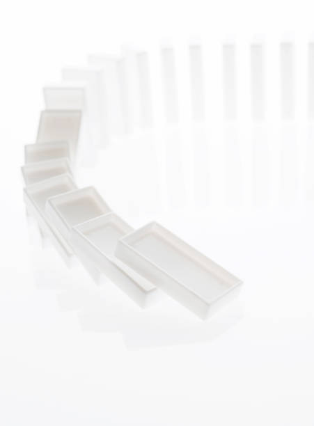 istock A row of white dominos falling down 1094782364