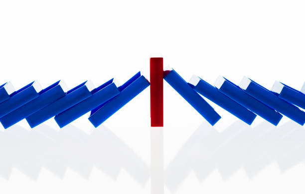 istock A row of blue dominos falling down 1094782398