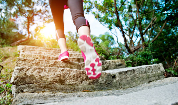 istock Woman feet walking on the steps 1094784976