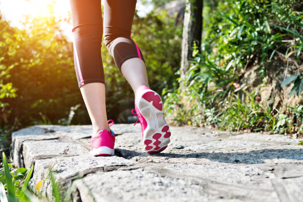 istock Woman feet walking on the footpath 1094785060