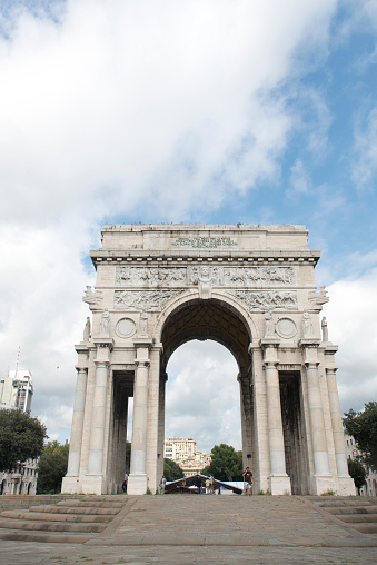 Genoa/Italy - September 13 2014: The Arch of Victory, an imposing triumphal arch located in Piazza della Vittoria in Genoa. It is dedicated to the Genoese who fell during the First World War.