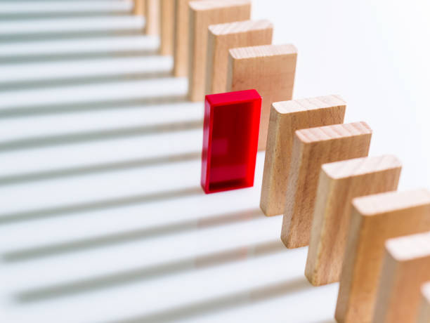istock The red domino stands out 1094788372