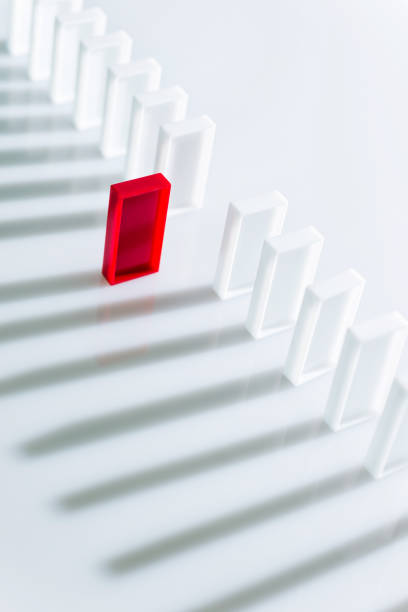 istock The red domino stands out 1094789420