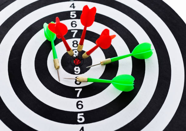 istock Red and green dart arrows on dartboard 1094789854