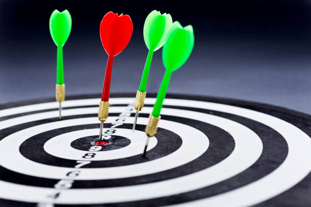 istock Dart board with arrows on black background 1094789970