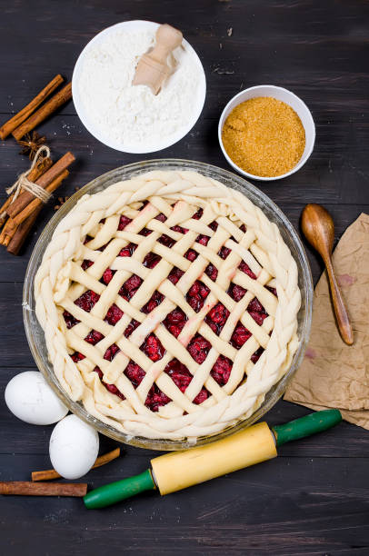 istock Raw cherry Pie in a glass round form and Ingredients 1094792296