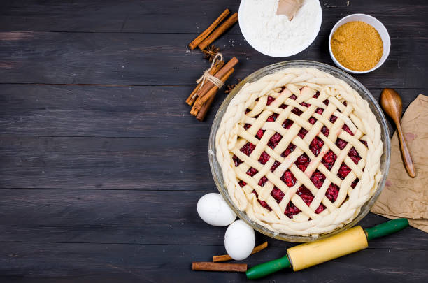 istock Raw cherry Pie in a glass round form and Ingredients 1094792410
