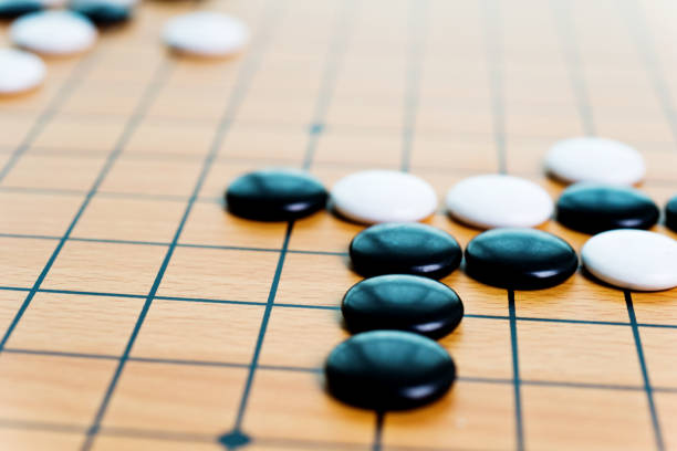 Chinese traditional go pieces are on the chessboard