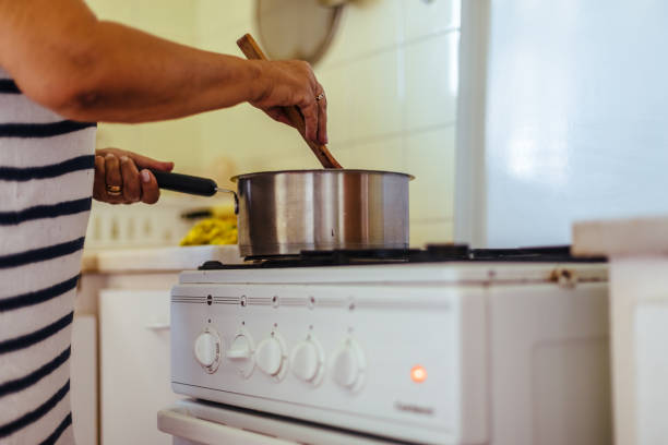 istock Woman cooking blackberry jam 1094797998