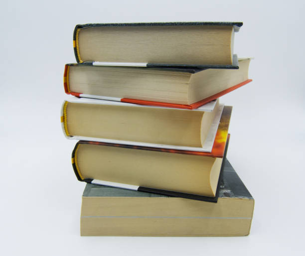 istock Pile of books on a table in white background 1094802018
