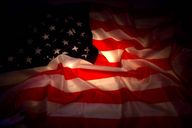 istock USA flag in the dark 1094803332