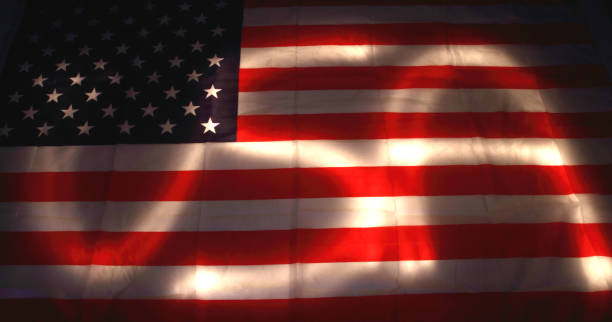 istock USA flag in the dark 1094803580
