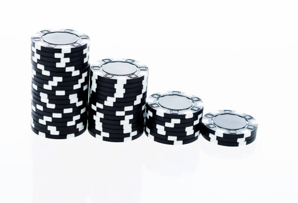 istock Stacks of black poker chips in a row 1094805974