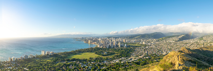 XXL panorama view of Honolulu and Waikiki Beach seen from the summit of Diamond Head Crater, Oahu, Hawaii. Beautiful evening just before sunset. Diamond Head is a popular hiking day trip for tourists.