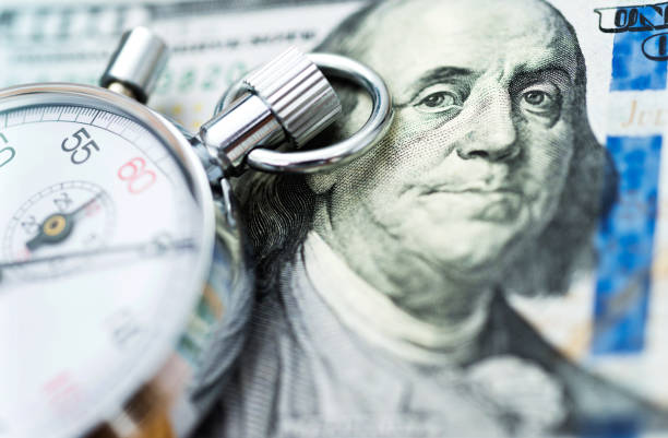 istock American dollar and stop watch 1094806516