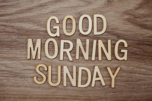 istock Good Morning Sunday text message on wooden background 1094809712