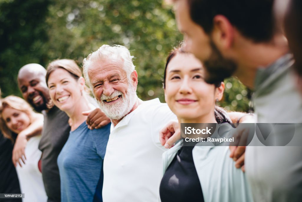 Happy diverse people together in the park People Stock Photo