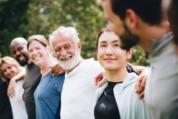 Happy diverse people together in the park Happy diverse people together in the park camaraderie stock pictures, royalty-free photos & images