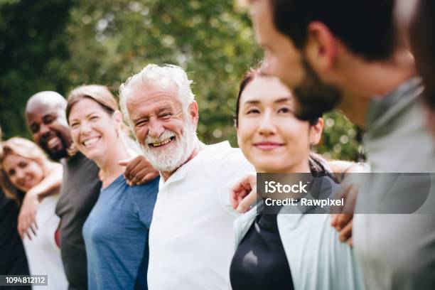 Happy Diverse People Together In The Park Stock Photo - Download Image Now - People, Community, Group Of People