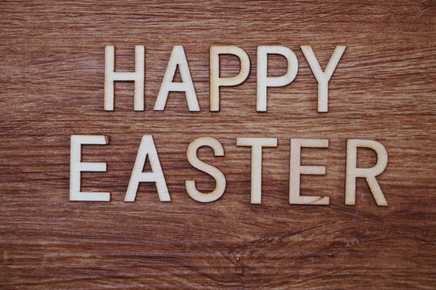 istock Happy Easter text message on wooden background 1094813226