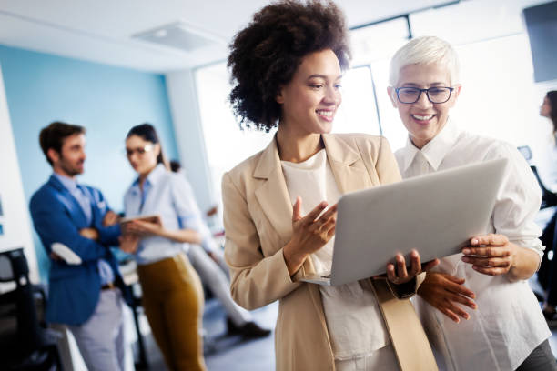 istock Happy business colleagues in modern office working together 1094815038