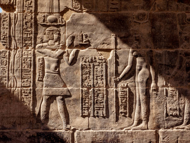 istock Egyptian hieroglyphs at Philae Temple in Aswan in sunset light 1094815482