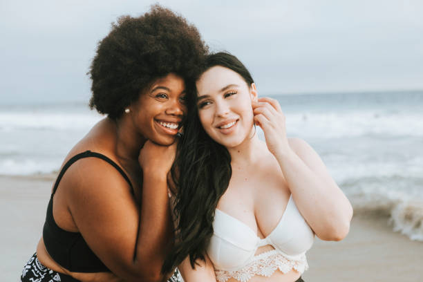 istock Cheerful beautiful plus size women at the beach 1094816598