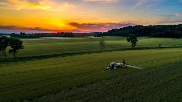 istock View of tractor working on field 1094818994