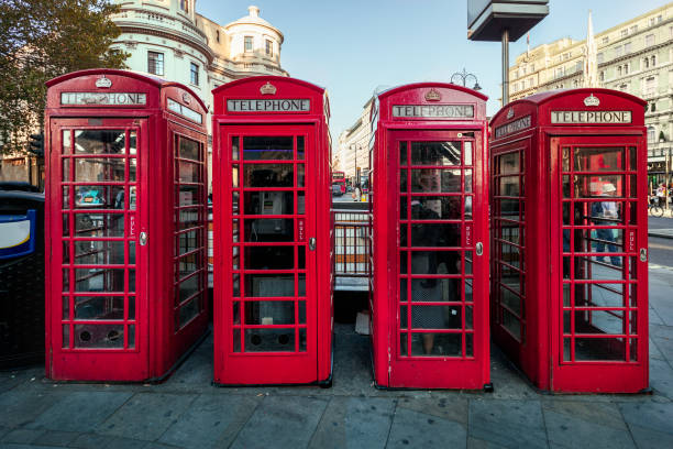 red telephone box row in london, uk. - england telephone telephone booth london england imagens e fotografias de stock