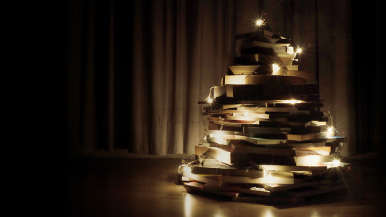 christmas tree made of books with lighting decoration