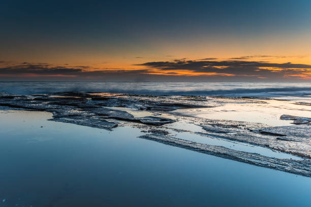 istock Rocky Sunrise Seascape 1094822540