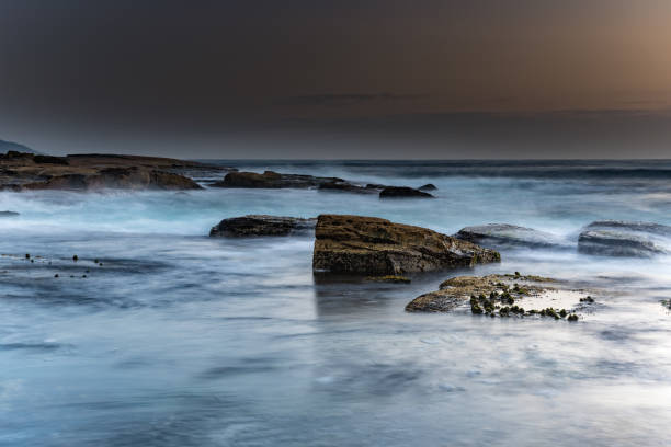 istock Rocky Sunrise Seascape 1094822542