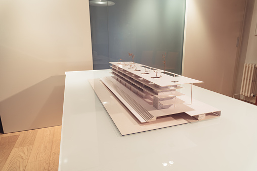 Architecture model made with cardboard on table in office of architectural firm