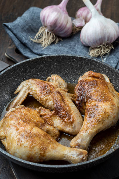 istock Grilled chicken legs with spices and garlic. 1094823308