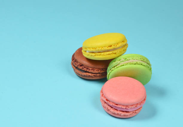 istock Many macaroons on a blue pastel background. Minimalism 1094823996